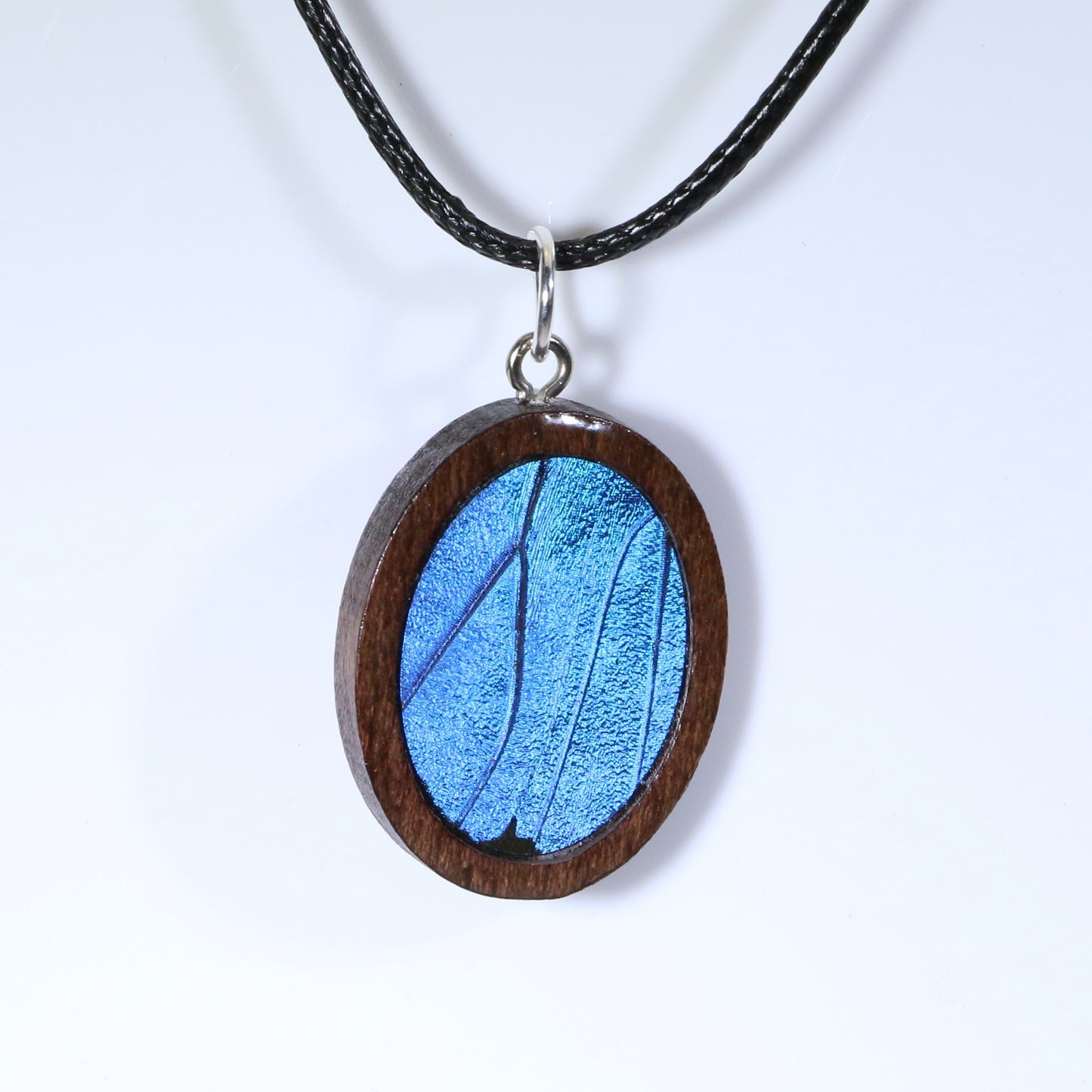 52611 - Real Butterfly Wing Jewelry - Pendant - Dark Wood - Oval - Blue Morpho